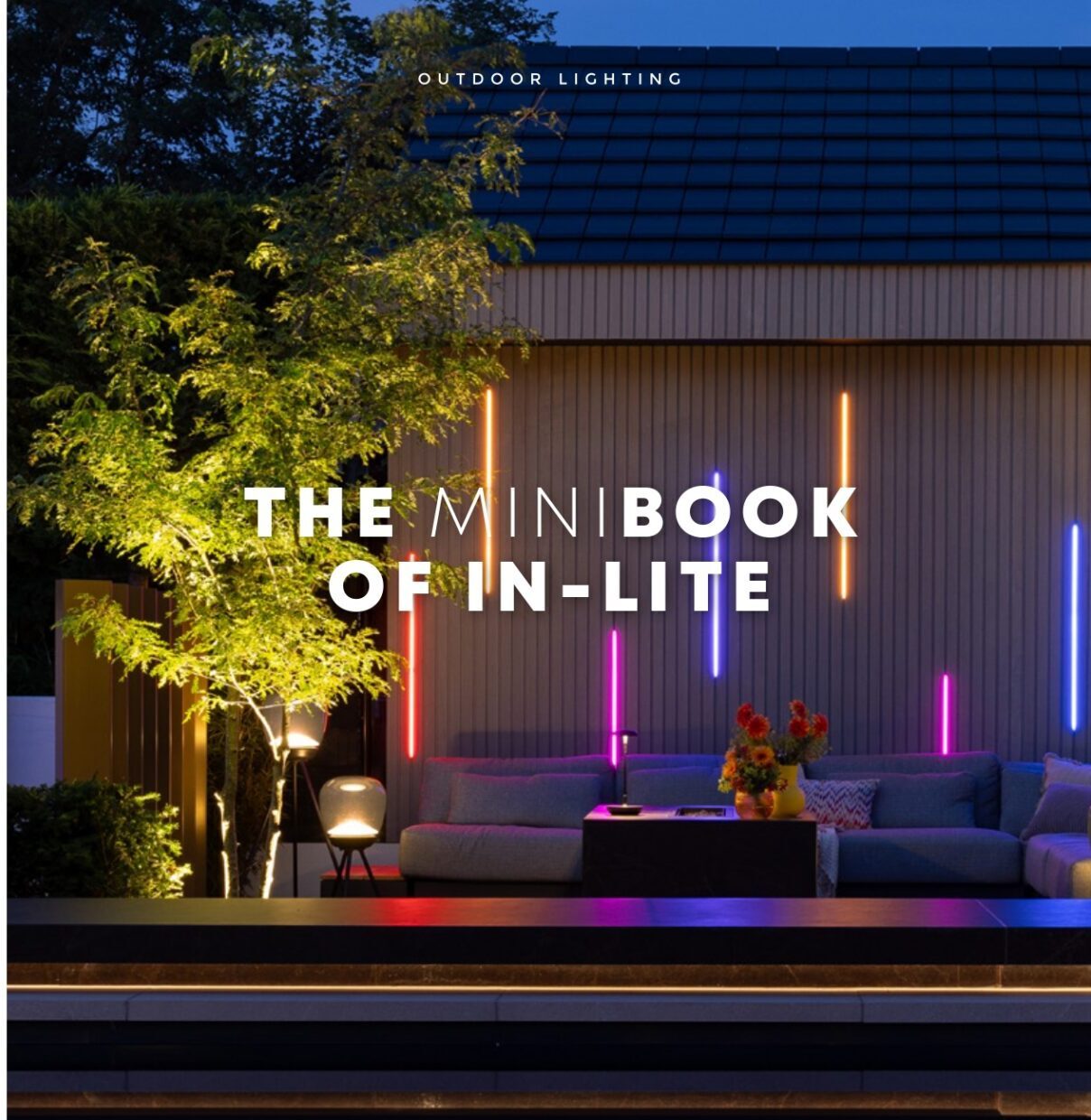 Outdoor setting featuring modern lighting, a cozy seating area with colorful lights, and lush greenery, promoting "The Mini Book of In-lite."