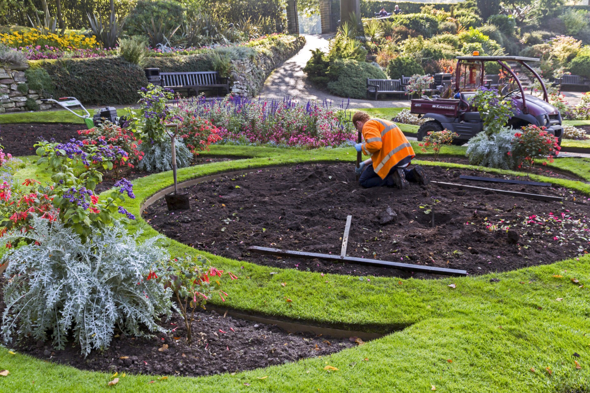 A team member putting down topsoil in Collingwood for a client's garden.