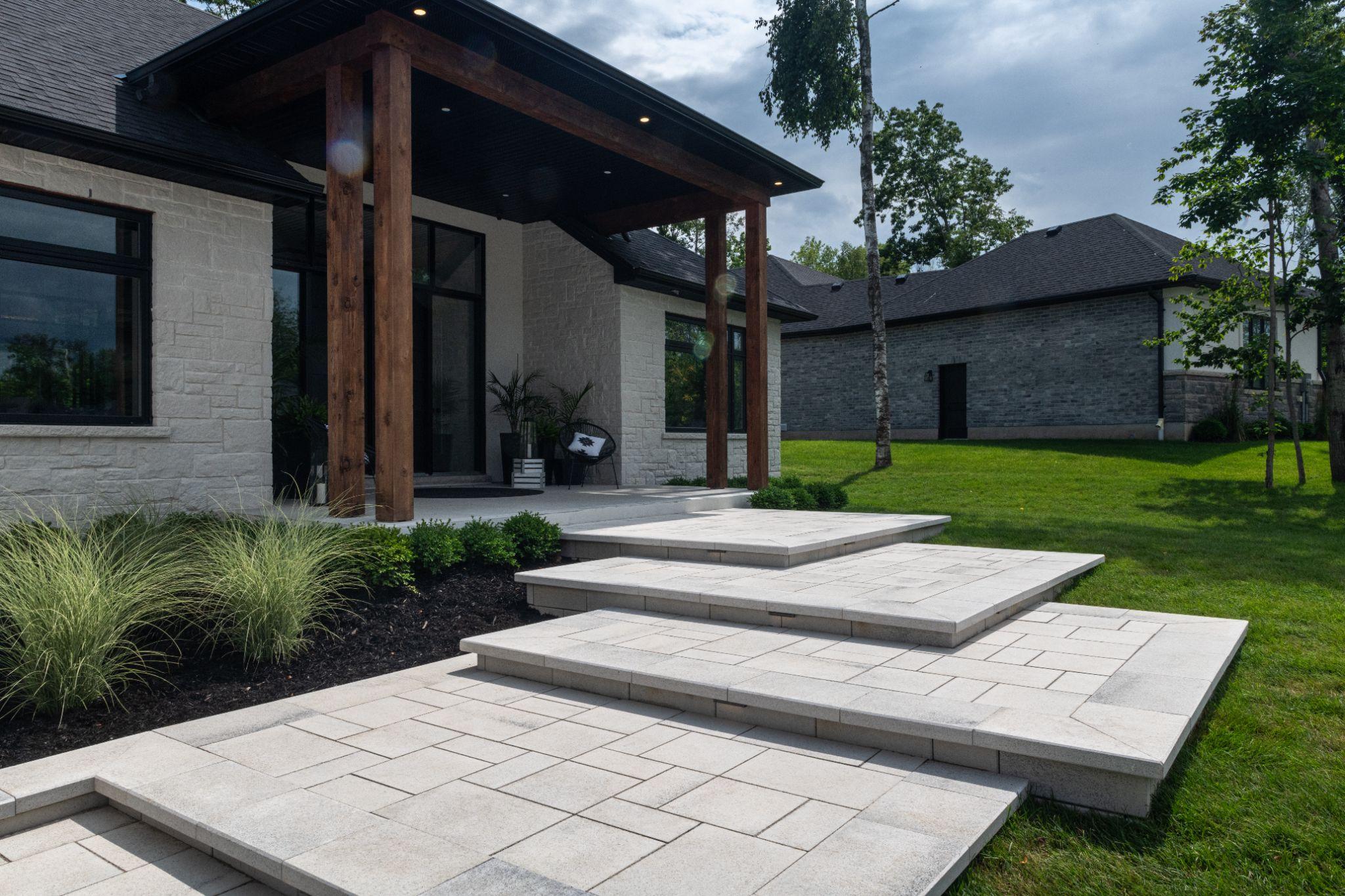 Contemporary front steps with large slab pavers
