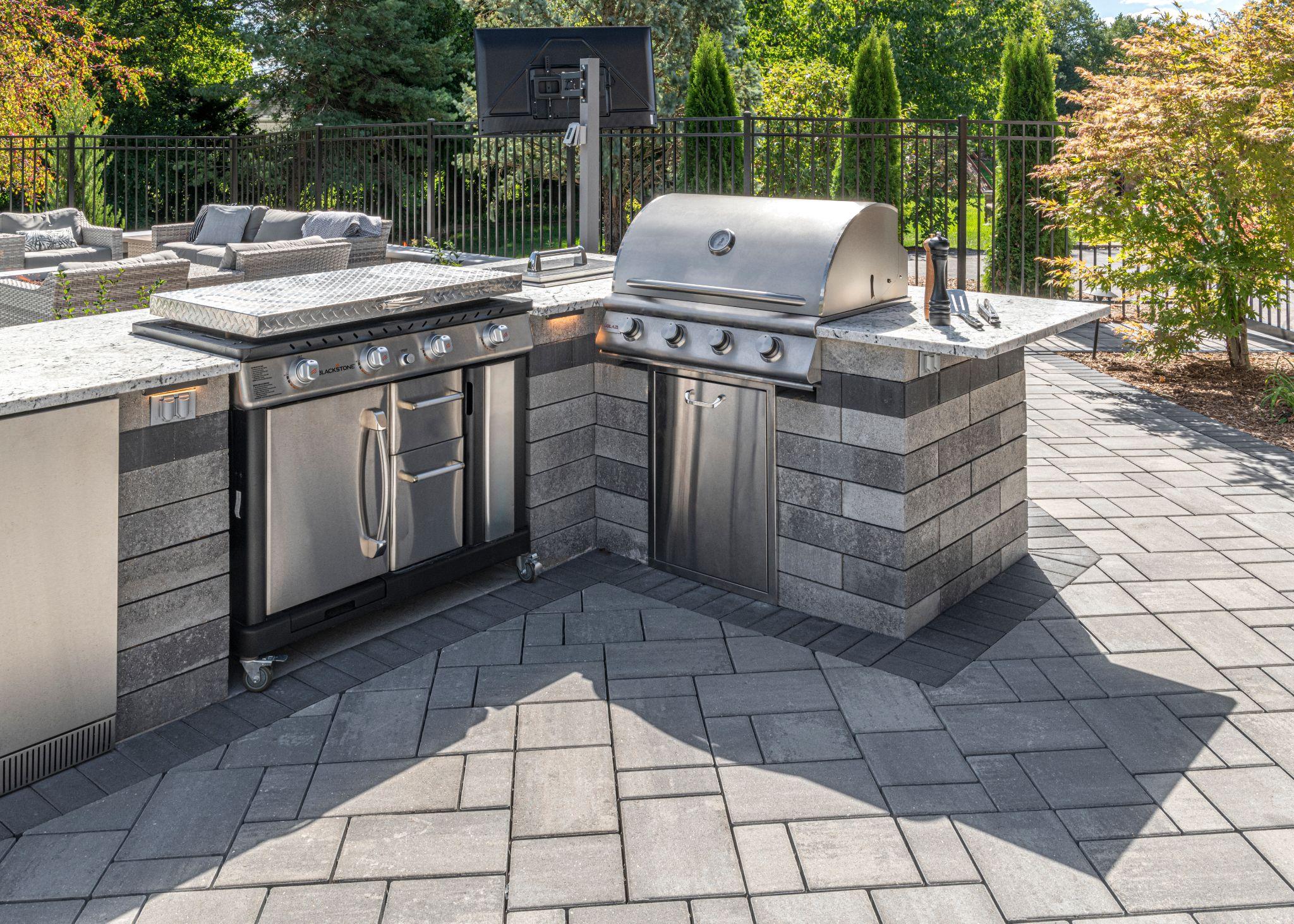 Outdoor kitchen with stone base and granite counters